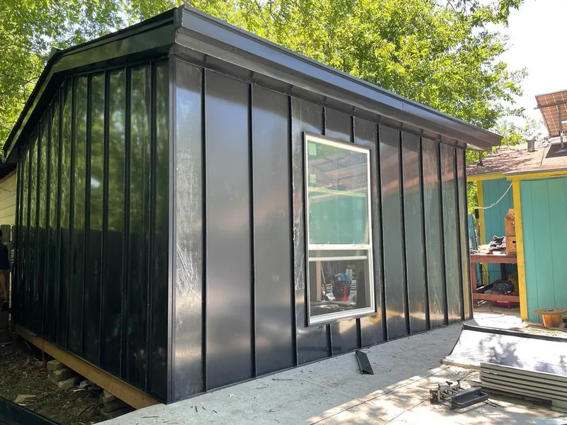 Black standing seam metal wall panels for Roof Inspection in Lake Lorraine